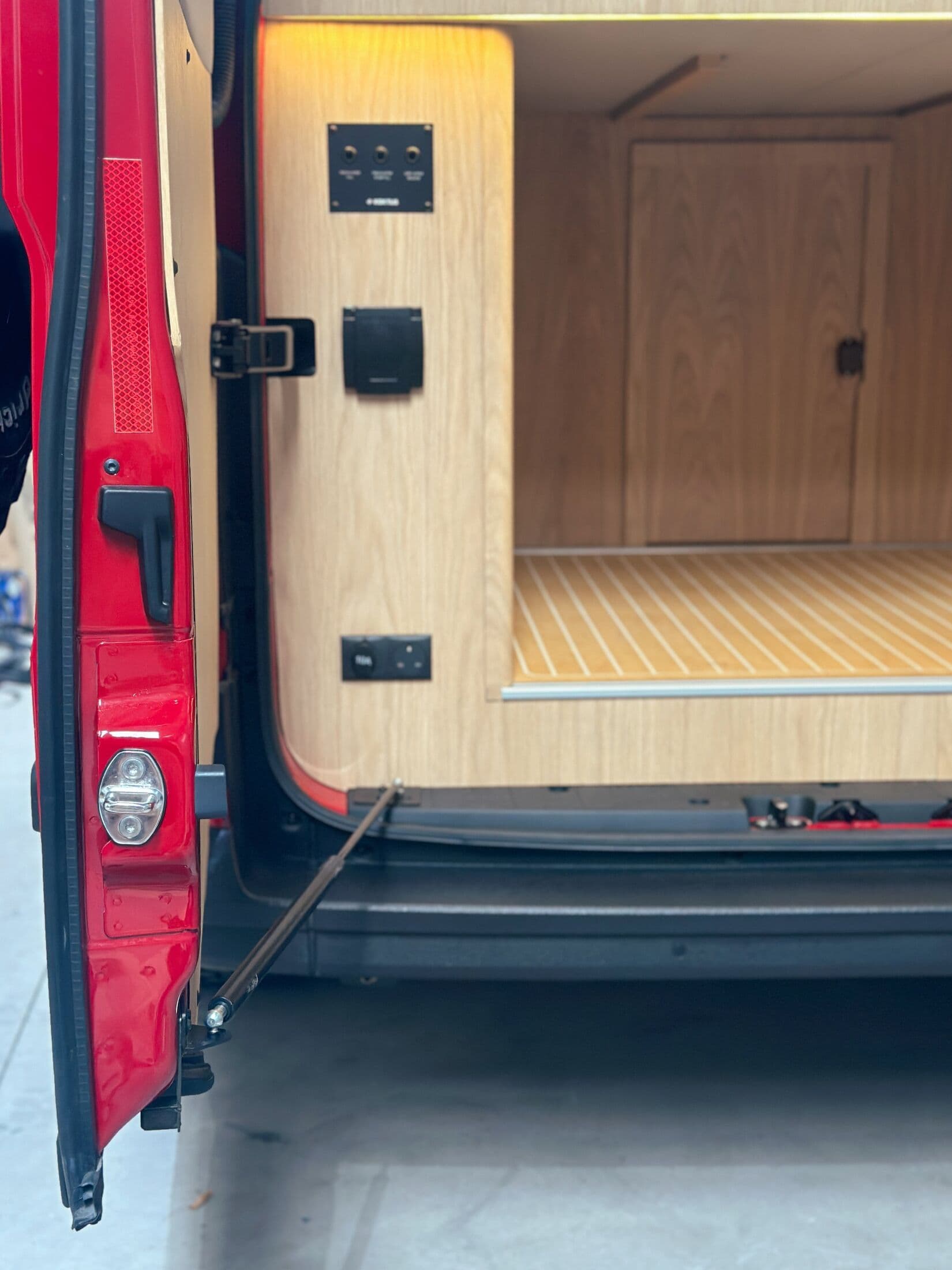 Heavy-duty rear door struts holding open the rear garage
